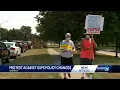 Protesters stand in support of USPS outside of Ankeny post office