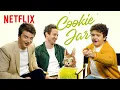 Joe Keery Gaten Matarazzo and Joseph Quinn Answer To a Nosy Cookie Jar Stranger Things Netflix
