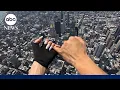 Daredevils climb to top of the Empire State Building display banner before proposal