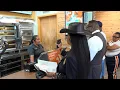 Quanell X and Dr Matthews call for answers after Popeyes customer finds foreign object in chicken