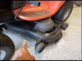 Adjust cutting deck height on a riding Husqvarna lawn mower