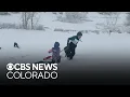 Despite power outages in Denver metro area many Coloradans enjoy the snow day