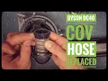 Vacuum repair man shows how to replace a Dyson COV hose