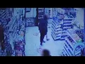 SUSPECT WANTED Surveillance from inside market shows altercation that led to shooting