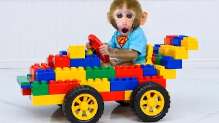 Monkey Baby Bon Bon and the duckling work together to reassemble the Lego car after the crash