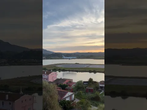 Passenger Jet Lands at Corfu Airport at Sunset