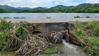 Cleaning a Blocked Culvert to Prevent Street Flooding