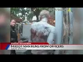 Man covered in mud wearing only a Speedo flees police