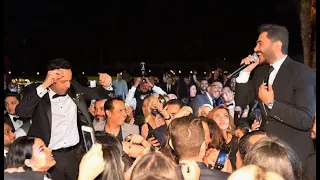 بالفيديو  تامرحسني يغني ويرقص ويشعل زفاف إبن مصطفي قمر بحضور النجوم ومطربي التسعينات ورد فعل الجمهور دندنها