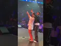 Kizz Daniel X female fan on stage
