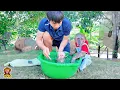 YoYo Jr helps  dad bathe the baby monkey