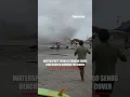 Waterspout turned TORNADO sends beachgoers running for cover