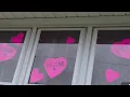 Plainville neighborhood turns on pink lights in honor of mother daughters killed by boyfriend
