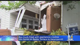Truck crashes into Swampscott home