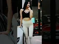 Lagu Black Hair Car Show Model in White Tight Pants
