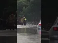 Fort Worth FD escort a female through flood waters in East Fort Worth on 6-3-2022