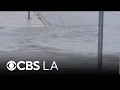 Rain flood Los Angeles County streets and create traffic nightmare for drivers