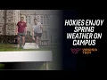 Hokies enjoy the warm weather on campus in Blacksburg