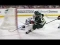 Erik Haula bats bouncing puck past Crawford