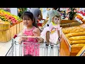 Diem hugging monkey Kaka sitting on a supermarket trolley is so cute
