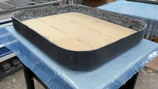 Laminating inside aft bulkhead hatch. This creates a sandwich construction a strong hatch.