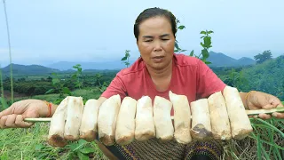 Mountain women found a lot of big mushroom at mountain. It's so yummy.