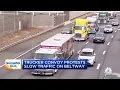 Trucker convoy protesting Covid measures slows traffic on D C Beltway