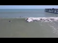 Surfers at Flagler Beach pier