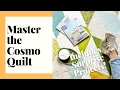 COSMO Quilt Pattern by Zen Chic shows a simple quilt , with straight lines and not much piecing, in shades of olive, blue and cream. - Video 3 of 1