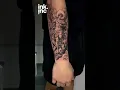 Saint Michael defeating devil forearm tattoo