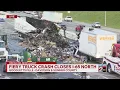 Crews continue to clear I-65 after crash involving 2 semi-trucks