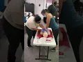 Two rescuers techniques on turning the pregnant women to the left side