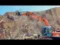 Lagu “Dangerous Excavator Work on Mountain | Huge Rocks Falling Near the Machine | Risky Stone Breaking”