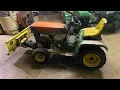 How to install a snow plow onto a John Deere series tractor