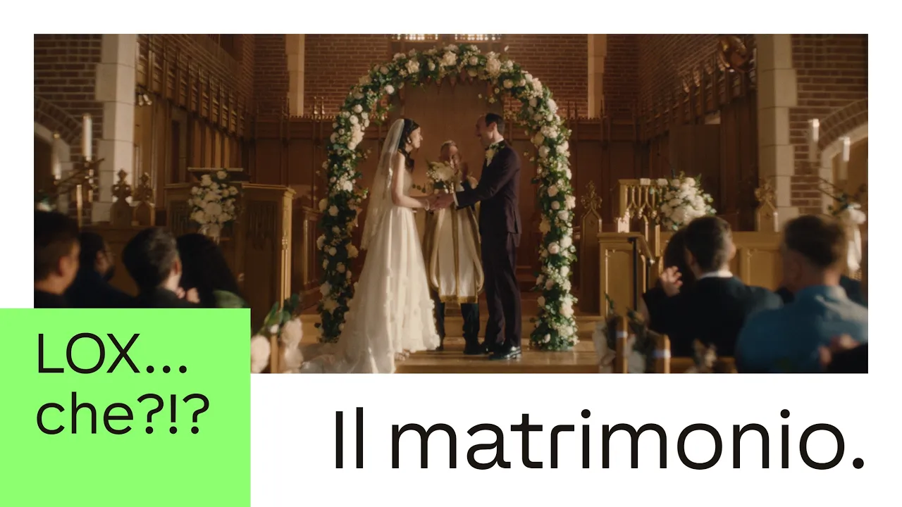 The video opens with a wide shot of a wedding ceremony taking place in a church. The bride and groom stand at the altar…