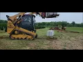 CAT 259d3 lifting 4000 bin block