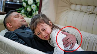 A girl hugs her dead father in a coffin, but then something amazing happens!