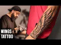 Realistic Wings Tattoo on Forearm