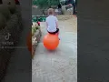 Boy Bouncing on Orange Hopper Ball