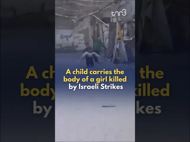 ⁣A girl who was killed by Israeli strike in Jabalia is carried by a boy amid a flood due to rain.