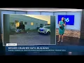 Woman hospitalized after backing car into building in Chesterfield