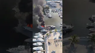 A boat in FLAMES here in the harbor the morning after I release a video with FIRE in the title