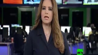woman arab tv news presenter in grey satin blouse 