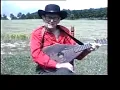 JIMMY DRIFTWOOD playing on his famous homemade guitar