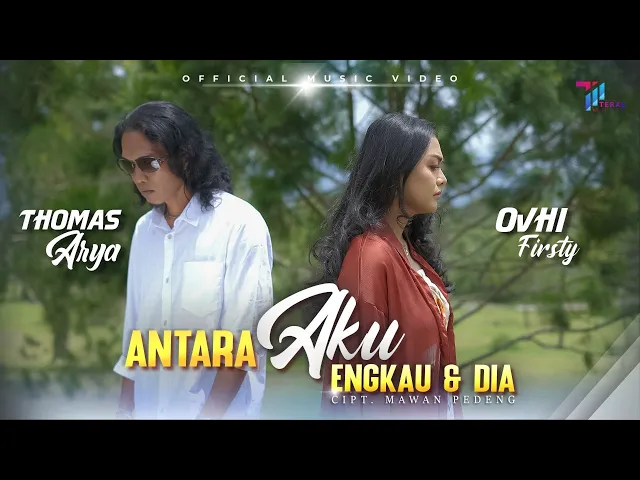 Download MP3 Thomas Arya feat Ovhi Firsty  - ANTARA AKU ENGKAU DAN DIA (Official Music Video)