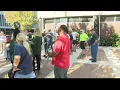 Community members rally outside of Peoria County Courthouse opposing proposed budget cuts to audito