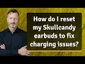 How do I reset my Skullcandy earbuds to fix charging issues