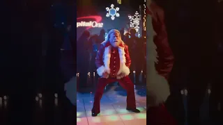John Travolta jingles into the holiday season as the coolest Santa