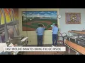 Inmates at East Moline Correctional Center paint mural of Quad Cities landmarks