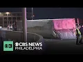 Tractor-trailer overturns near base of the Ben Franklin Bridge in Philadelphia